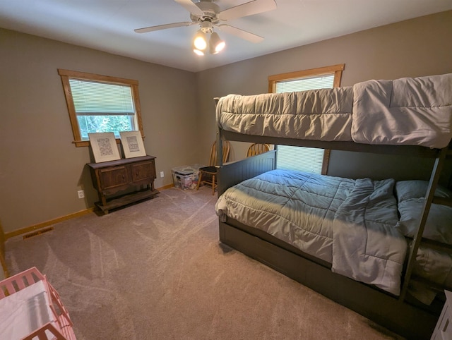 2740 Booth Rd, Au Gres, MI 48703 - bedroom featuring multiple windows, carpet, and ceiling fan