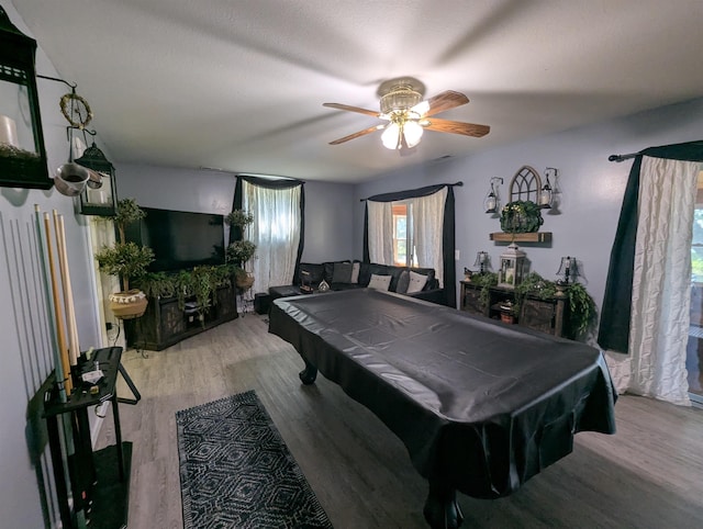 2740 Booth Rd, Au Gres, MI 48703 - rec room with pool table, a ceiling fan, and wood finished floors