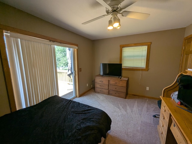 2740 Booth Rd, Au Gres, MI 48703 - bedroom with access to outside, light carpet, and ceiling fan