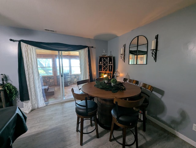 2740 Booth Rd, Au Gres, MI 48703 - dining area featuring wood finished floors and baseboards