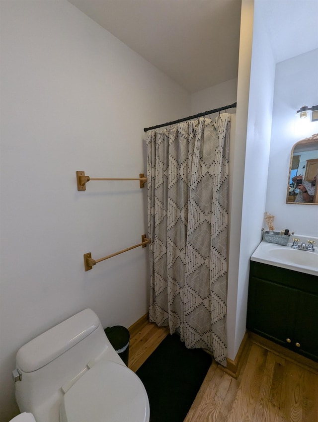 2740 Booth Rd, Au Gres, MI 48703 - full bath featuring wood finished floors, vanity, and curtained shower