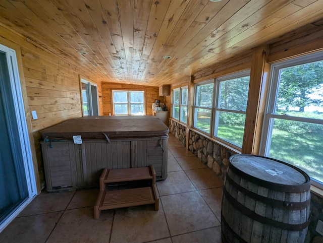 2740 Booth Rd, Au Gres, MI 48703 - sunroom featuring a hot tub, tile patterned floors, wooden walls, and wooden ceiling