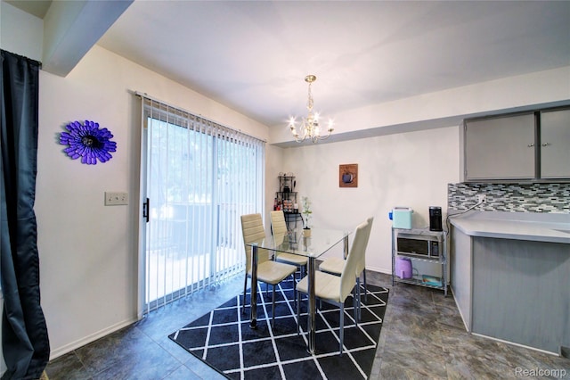 6397 Hunter Pointe St, Westland, MI 48185 - dining area featuring a chandelier and baseboards