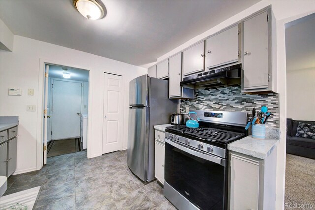 6397 Hunter Pointe St, Westland, MI 48185 - kitchen featuring stainless steel appliances, under cabinet range hood, light countertops, decorative backsplash, and gray cabinetry