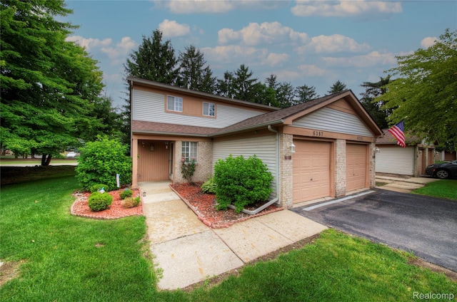 6397 Hunter Pointe St, Westland, MI 48185 - traditional-style house featuring a front lawn, driveway, a garage, and brick siding