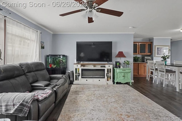 26317 Cherokee E, Flat Rock, MI 48134 - living area with ornamental molding, dark wood-style flooring, ceiling fan, and plenty of natural light