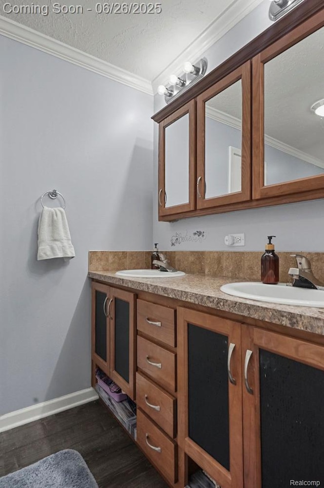 26317 Cherokee E, Flat Rock, MI 48134 - bathroom featuring wood finished floors, double vanity, and crown molding