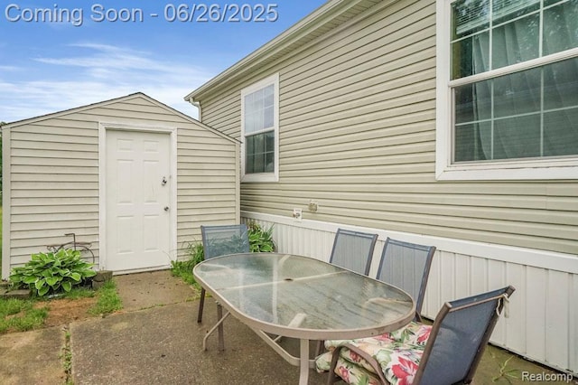 26317 Cherokee E, Flat Rock, MI 48134 - view of patio / terrace featuring outdoor dining area and a storage unit