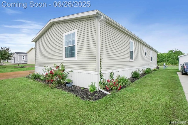 26317 Cherokee E, Flat Rock, MI 48134 - view of side of property featuring a lawn