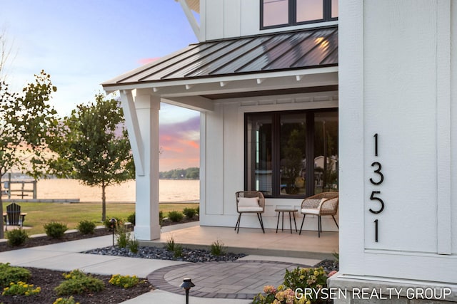 1351 Bayview Dr, Holland, MI 49423 - entrance to property with a standing seam roof, a metal roof, and covered porch