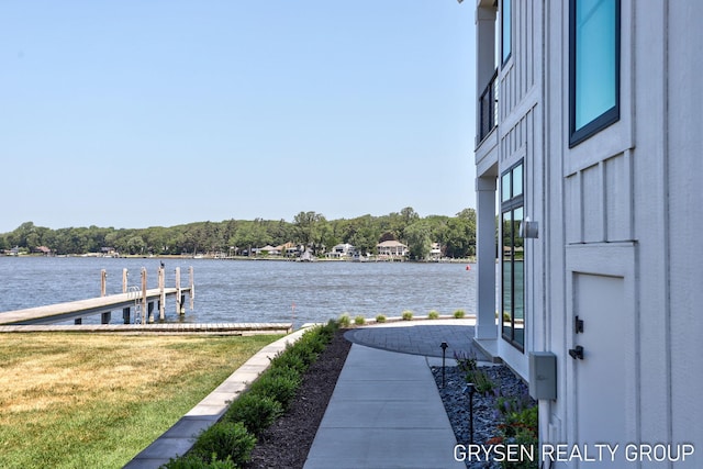 1351 Bayview Dr, Holland, MI 49423 - dock with a water view and a lawn