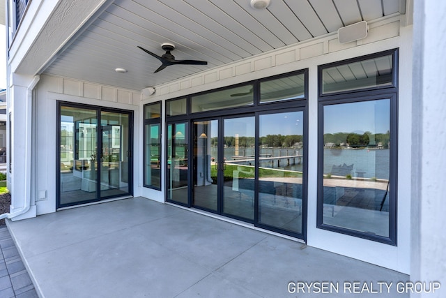 1351 Bayview Dr, Holland, MI 49423 - view of patio / terrace featuring a water view and a ceiling fan