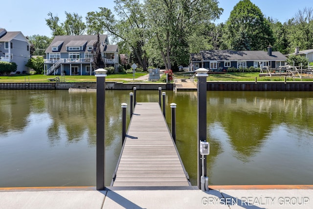 1351 Bayview Dr, Holland, MI 49423 - dock area with a water view and a residential view