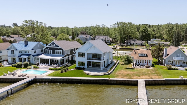 1351 Bayview Dr, Holland, MI 49423 - back of house with a balcony, a water view, and a residential view
