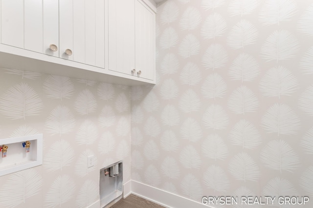 1351 Bayview Dr, Holland, MI 49423 - laundry area featuring wallpapered walls, cabinet space, and hookup for a washing machine