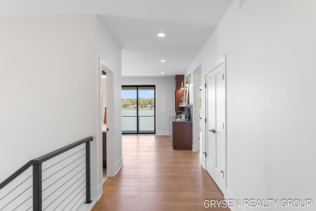 1351 Bayview Dr, Holland, MI 49423 - corridor featuring recessed lighting, light wood-style floors, and a water view