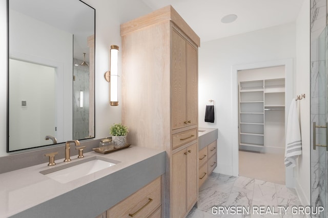 1351 Bayview Dr, Holland, MI 49423 - full bath with vanity, a marble finish shower, marble finish flooring, and a walk in closet