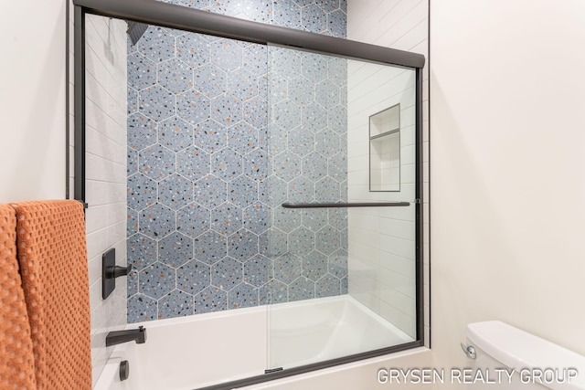 1351 Bayview Dr, Holland, MI 49423 - full bathroom featuring combined bath / shower with glass door and toilet