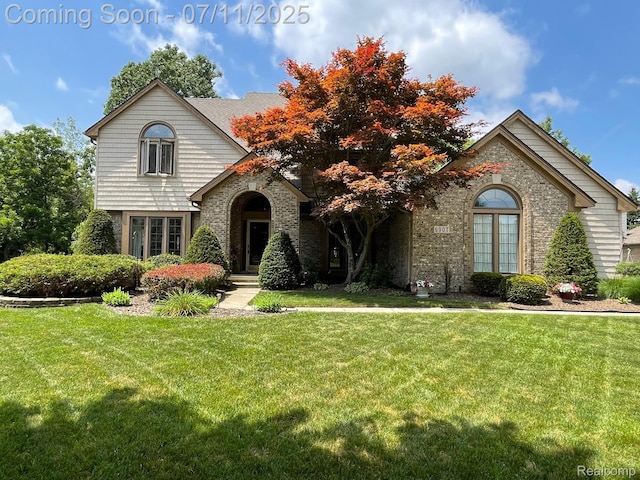 6907 Kings Mill Dr, Canton, MI 48187 - view of front of home with a front lawn and brick siding