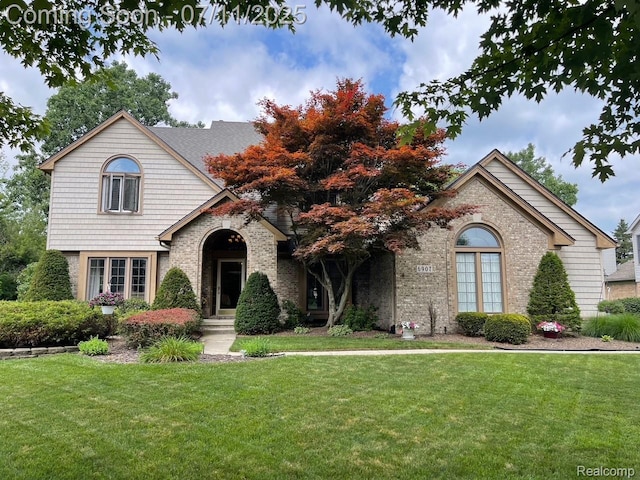 6907 Kings Mill Dr, Canton, MI 48187 - view of front of house with a front lawn and brick siding