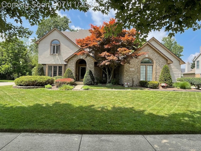 6907 Kings Mill Dr, Canton, MI 48187 - view of front of home with a front lawn and brick siding
