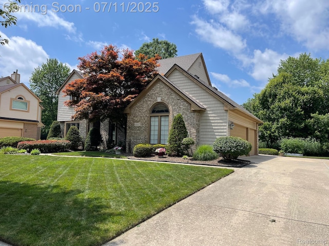 6907 Kings Mill Dr, Canton, MI 48187 - view of front facade with an attached garage, a front lawn, concrete driveway, and brick siding