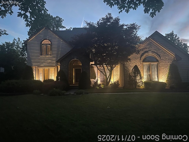 6907 Kings Mill Dr, Canton, MI 48187 - traditional-style house featuring brick siding and a front lawn