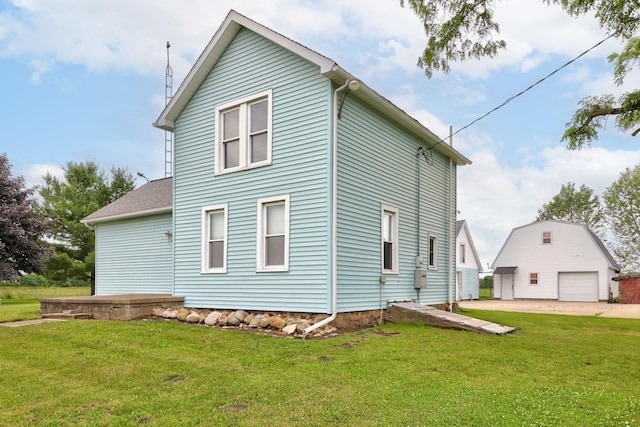 8075 Caine Rd, Millington, MI 48746 - view of property exterior with a garage, a lawn, and an outdoor structure