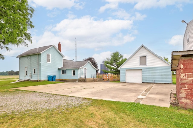 8075 Caine Rd, Millington, MI 48746 - view of grassy yard featuring an outdoor structure and a garage