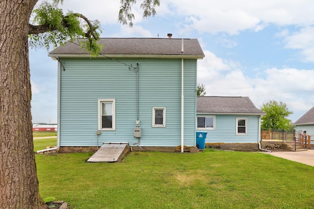 8075 Caine Rd, Millington, MI 48746 - back of property featuring a yard and a shingled roof