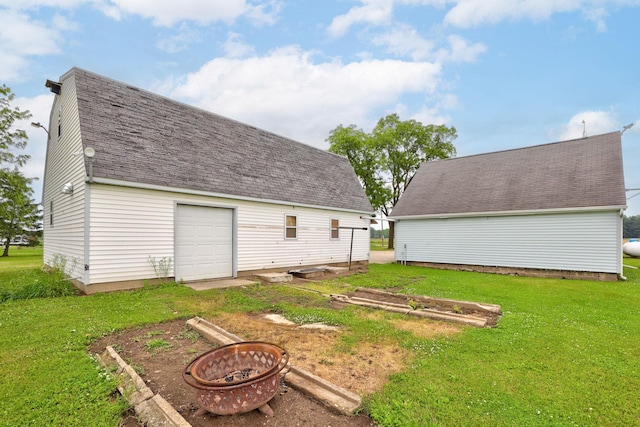 8075 Caine Rd, Millington, MI 48746 - view of grassy yard with a fire pit and an outdoor structure