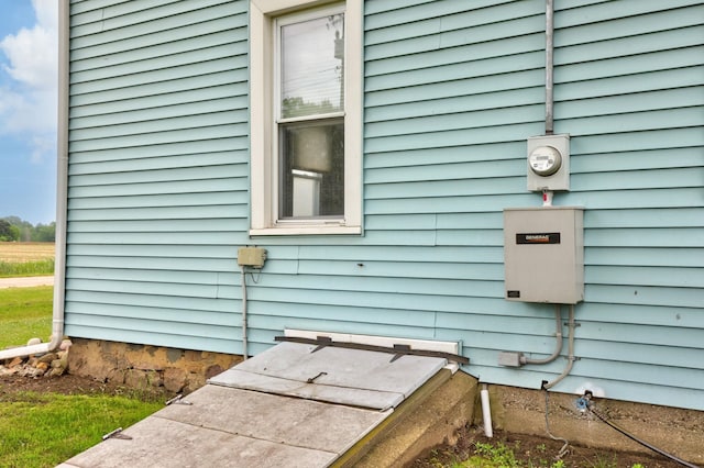 8075 Caine Rd, Millington, MI 48746 - exterior view of electric meter and a bulkhead entry