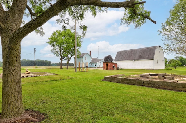 8075 Caine Rd, Millington, MI 48746 - view of grassy yard with an outbuilding