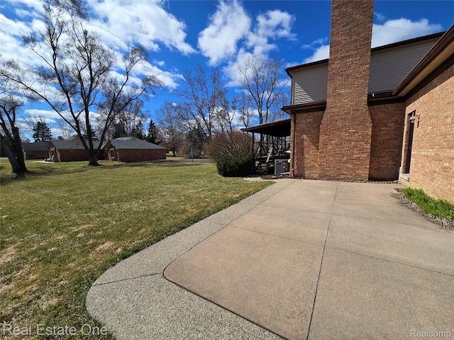 4280 Snoal Ln, Shelby Twp, MI 48316 - view of green lawn with a patio area