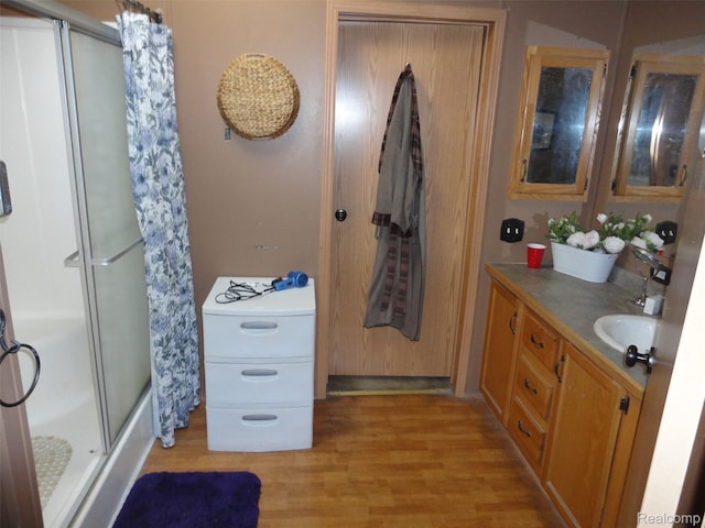 29269 Hidden River Dr, Gibraltar, MI 48173 - full bath with curtained shower, wood finished floors, and vanity