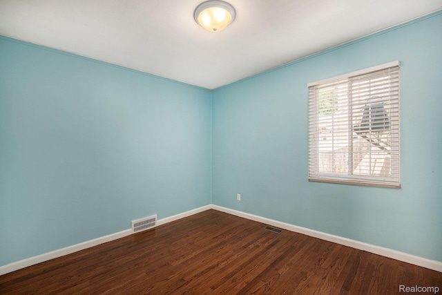 964 W Marshall St, Ferndale, MI 48220 - unfurnished room featuring baseboards and dark wood-type flooring