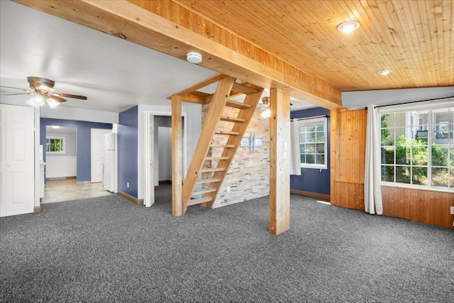 12915 S Englewright Dr, Sand Lake, MI 49343 - unfurnished living room with stairway, carpet floors, ceiling fan, wooden ceiling, and recessed lighting