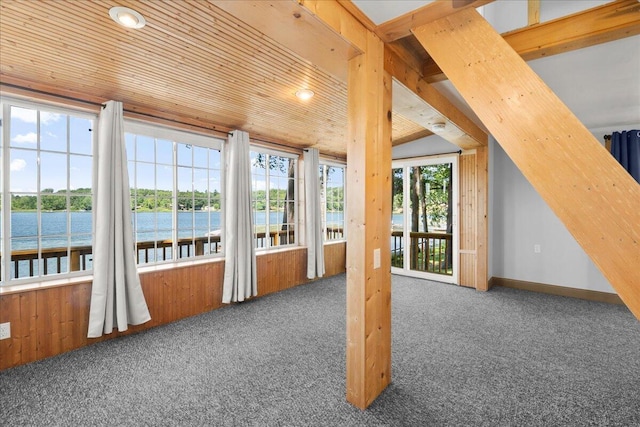 12915 S Englewright Dr, Sand Lake, MI 49343 - unfurnished sunroom with carpet flooring, a water view, healthy amount of natural light, and recessed lighting
