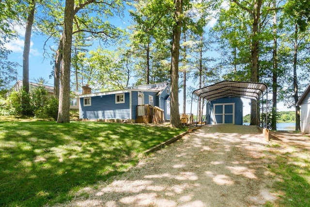12915 S Englewright Dr, Sand Lake, MI 49343 - view of front facade featuring a carport, a front yard, dirt driveway, and a chimney