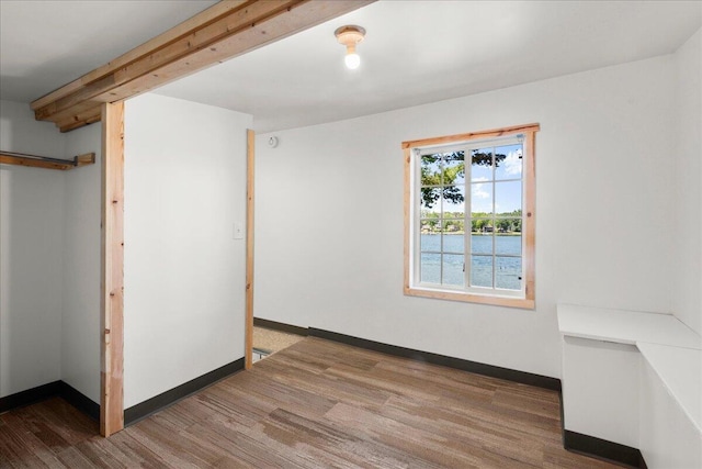 12915 S Englewright Dr, Sand Lake, MI 49343 - empty room featuring wood finished floors and baseboards