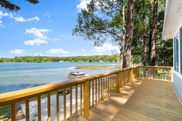 12915 S Englewright Dr, Sand Lake, MI 49343 - wooden terrace featuring a water view