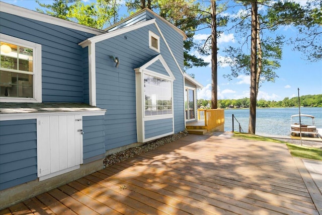 12915 S Englewright Dr, Sand Lake, MI 49343 - wooden deck with a water view