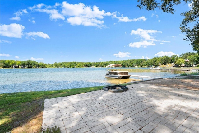 12915 S Englewright Dr, Sand Lake, MI 49343 - view of patio with a water view and a dock