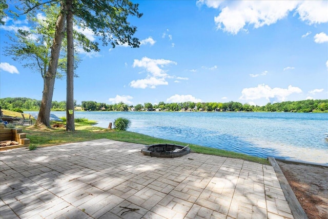 12915 S Englewright Dr, Sand Lake, MI 49343 - view of patio / terrace featuring an outdoor fire pit and a water view