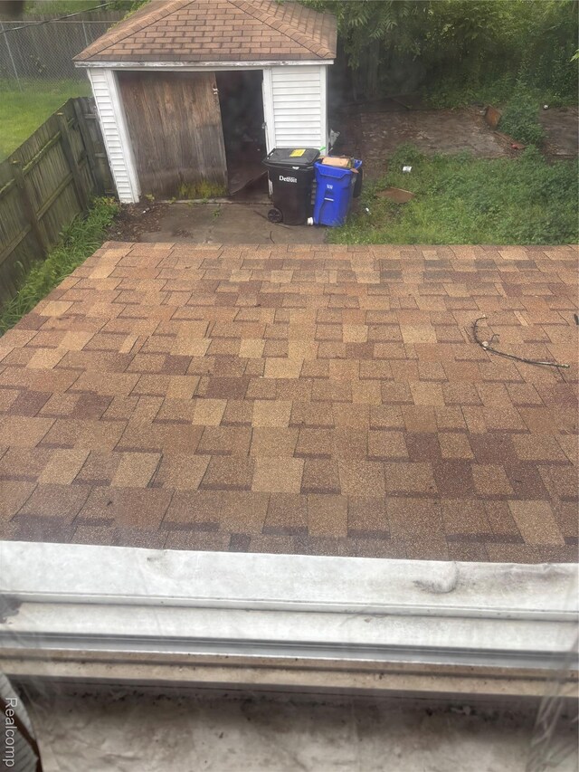 16551 Ardmore St, Detroit, MI 48235 - fenced backyard with a storage unit and a patio