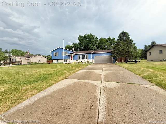 8588 Tim Tam Trl, Flushing, MI 48433 - split level home with concrete driveway, a front yard, a garage, and board and batten siding