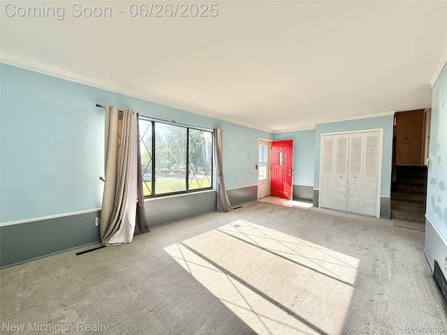 8588 Tim Tam Trl, Flushing, MI 48433 - unfurnished living room featuring carpet floors and crown molding