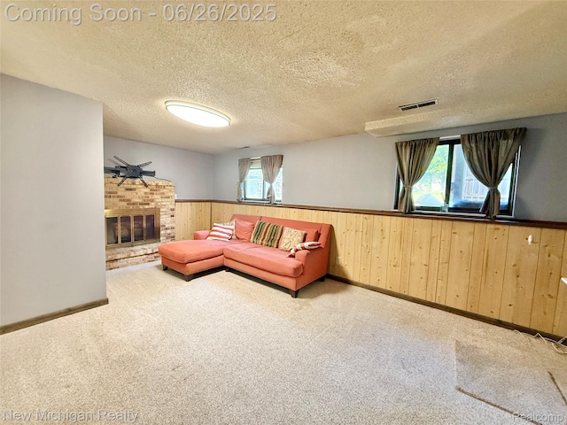 8588 Tim Tam Trl, Flushing, MI 48433 - living room featuring wainscoting, wood walls, healthy amount of natural light, carpet floors, and a textured ceiling