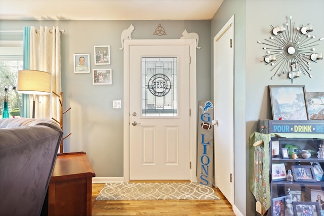 5255 E Holland Rd, Saginaw, MI 48601 - entrance foyer featuring wood finished floors and a chandelier