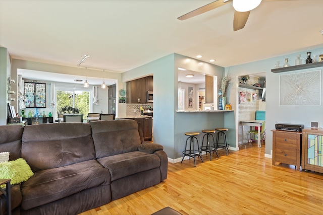 5255 E Holland Rd, Saginaw, MI 48601 - living area with light wood-type flooring and a ceiling fan